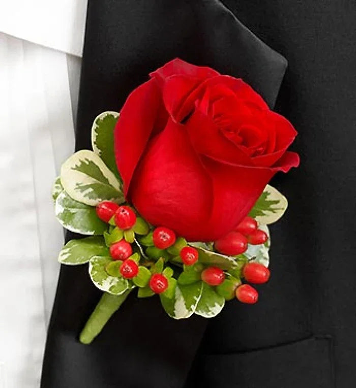 All Red Boutonniere with fresh red rose, greenery, and berry accents, handcrafted for weddings and proms, same-day NYC delivery.