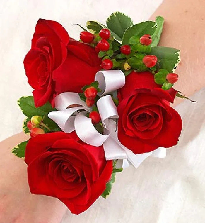 All Red Corsage featuring fresh red roses with greenery and ribbon accents, handcrafted for weddings and proms, same-day NYC delivery.