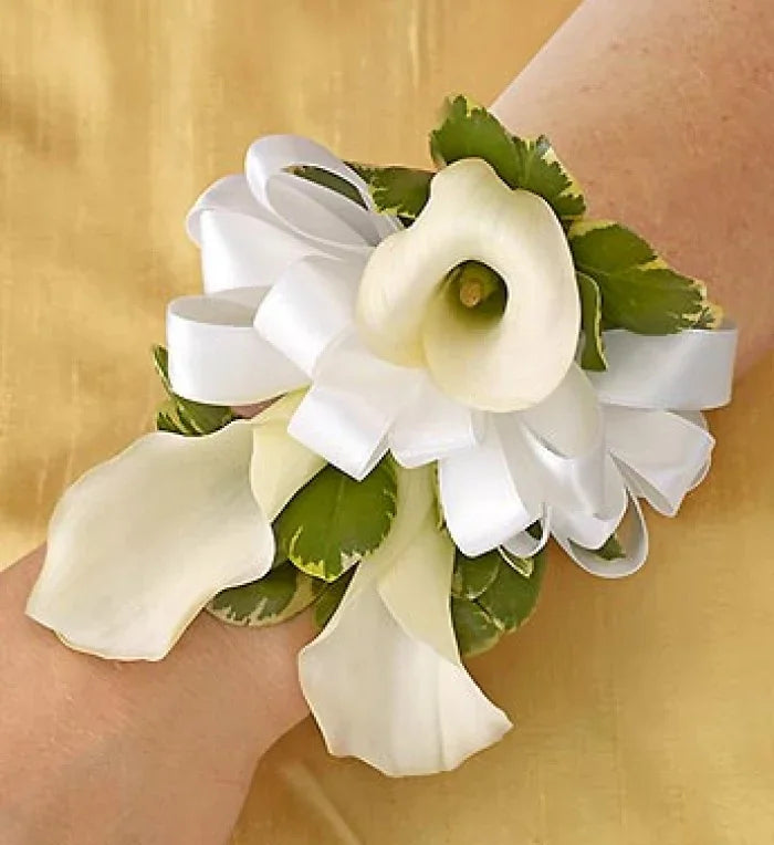 All White Corsage featuring fresh white calla lilies with ribbon accents, handcrafted for weddings and proms, same-day NYC delivery.