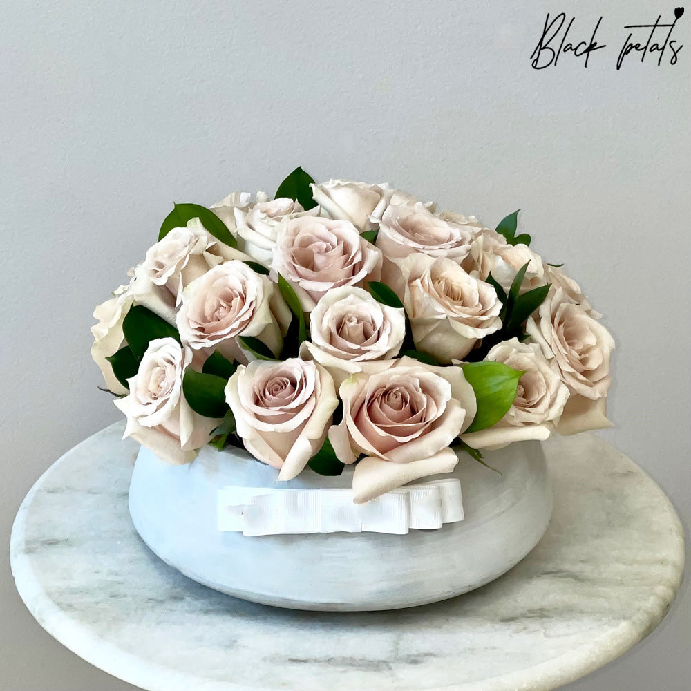 Beige Roses In A Ceramic Vase
