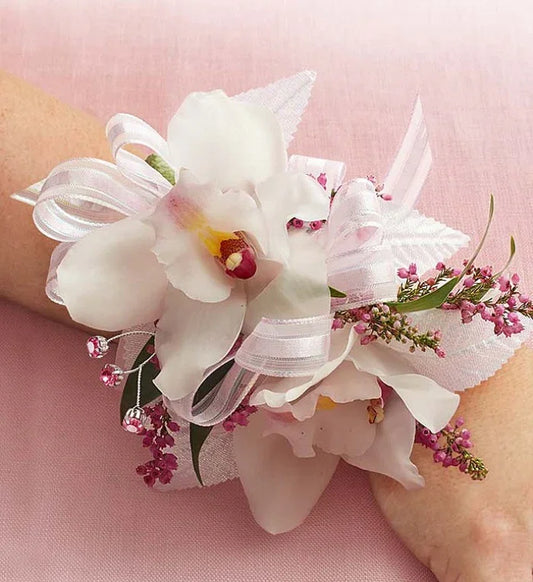 Cymbidium Orchid Corsage with white orchids, greenery, and ribbon accents, perfect for weddings and proms with same-day NYC delivery.