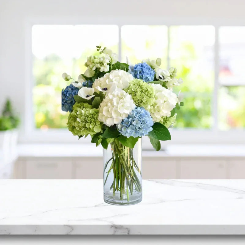 Fresh Dewfall Arrangement with white, green, and blue hydrangeas in a vase, available for same-day Manhattan & NYC flower delivery.