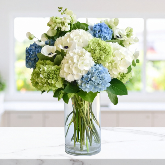 Fresh Dewfall Arrangement with white, green, and blue hydrangeas in a vase, available for same-day Manhattan & NYC flower delivery.
