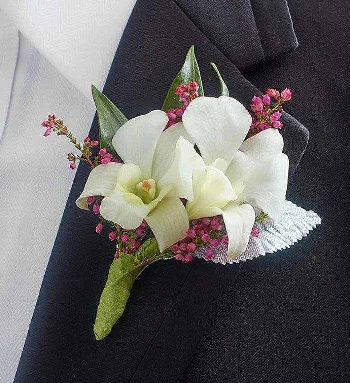 Elegant White Dendrobium Orchid Boutonniere for weddings and formal events, available with same-day delivery in Manhattan & NYC.