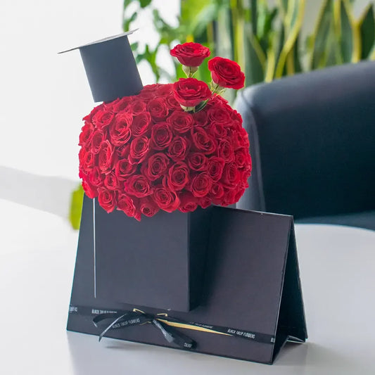 Round Graduation Hat Flower Arrangement - Black Petals