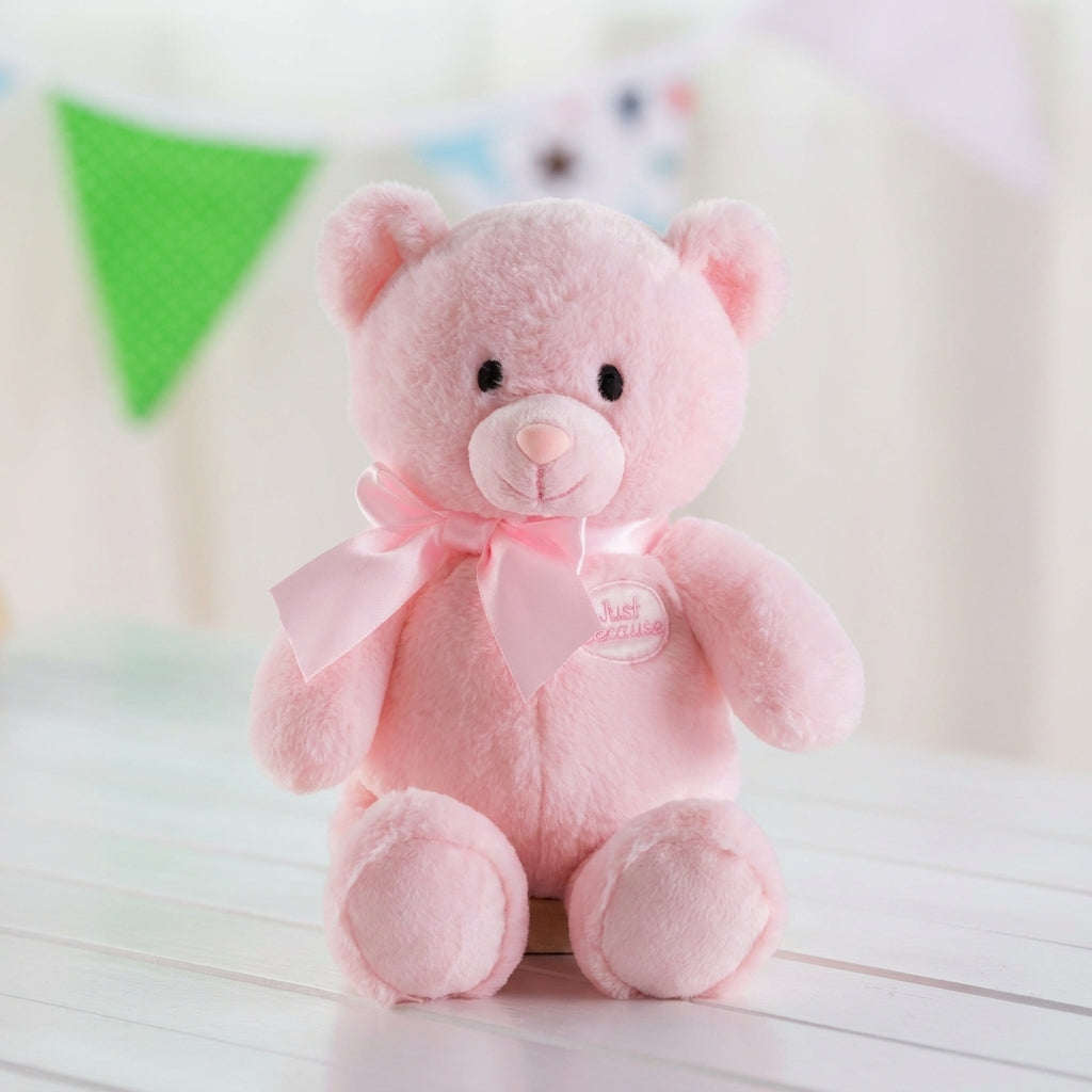 Soft pink plush teddy bear with a satin pink ribbon, perfect as a gift for newborn baby girls, baby showers, hospital deliveries, birthdays, anniversaries, Valentine's Day, and special occasions.