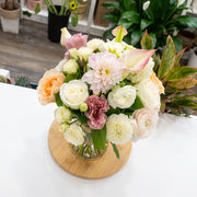 Pastel dahlia flower arrangement with white and peach roses, ranunculus, pink calla lilies and blush flowers