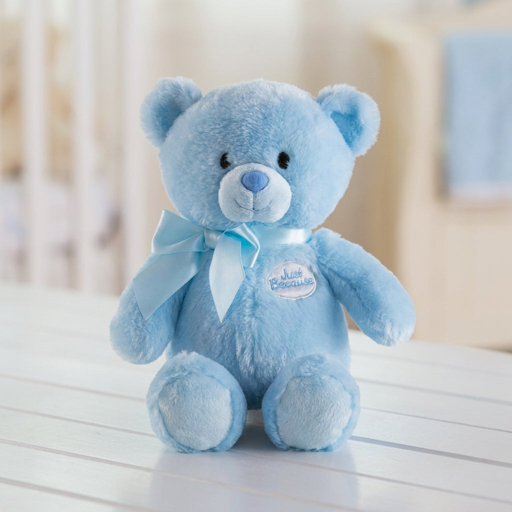 Soft blue plush teddy bear with a satin blue ribbon, perfect as a gift for newborn baby boys, birthdays, baby showers, hospital deliveries, anniversaries, Valentine's Day, and special occasions.