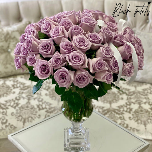 75 BP Lavender Roses In A Glass Vase