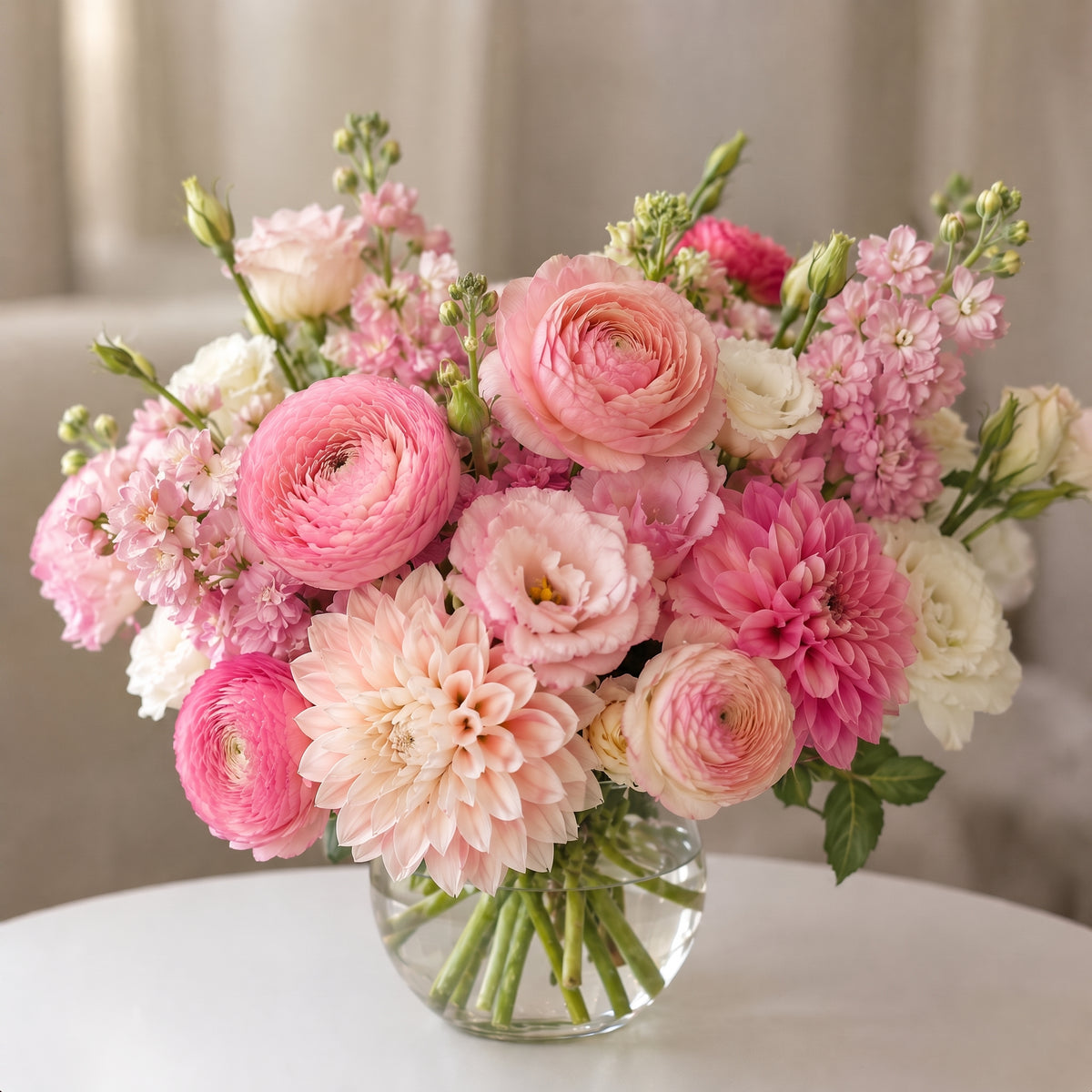 Pink dahlia floral arrangement with ranunculus, blush flowers and white blooms