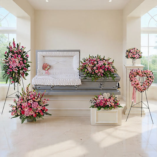 Forever in Our Hearts sympathy flowers with pink roses and lilies for funeral and memorial services