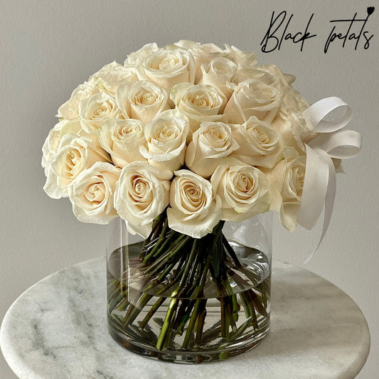 Clean And Classic White Roses In A Vase