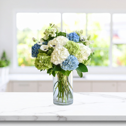 Fresh Dewfall Arrangement with white, green, and blue hydrangeas in a vase, available for same-day Manhattan & NYC flower delivery.