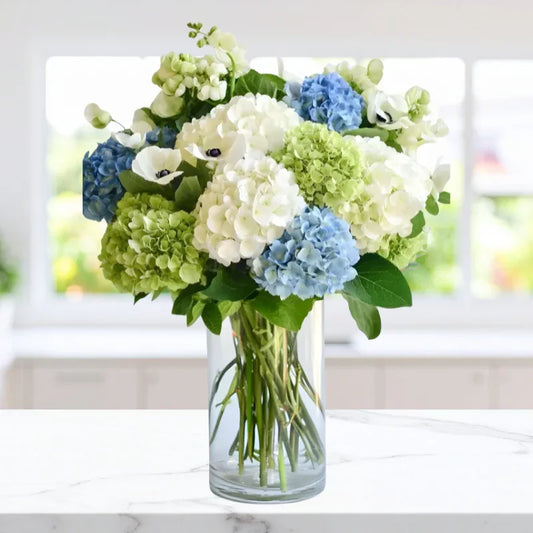 Fresh Dewfall Arrangement with white, green, and blue hydrangeas in a vase, available for same-day Manhattan & NYC flower delivery.