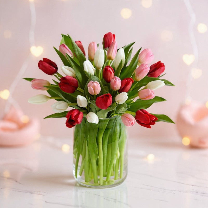 Mixed tulip bouquet in a clear glass vase