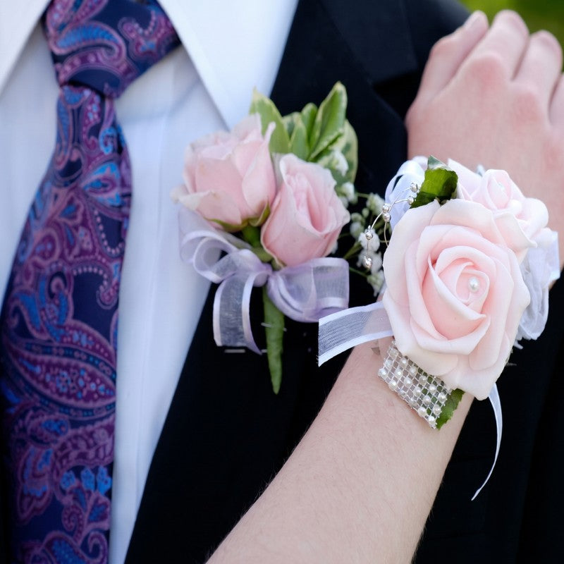Handmade blush pink rose wrist corsage paired with matching prom boutonniere