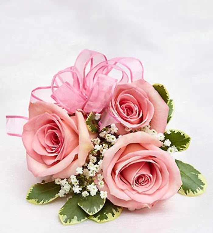 Pink Rose Corsage with fresh roses, ribbon, and greenery, handcrafted for weddings, proms, and events with NYC same-day delivery.
